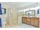 Well-lit bathroom featuring double sinks, shower, toilet, and natural light at 36 Birnamwood Dr, Chapel Hill, NC 27516