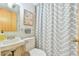 Cozy bathroom featuring neutral color scheme and shower with patterned curtain at 36 Birnamwood Dr, Chapel Hill, NC 27516
