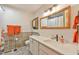 Well-lit bathroom with a large mirror, decorative tile accents, and modern vanity with sink at 36 Birnamwood Dr, Chapel Hill, NC 27516