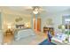 Relaxing bedroom with fan, desk, and hardwood floors, with good natural light at 36 Birnamwood Dr, Chapel Hill, NC 27516
