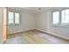 Bright bedroom features hardwood floors and views of backyard at 36 Birnamwood Dr, Chapel Hill, NC 27516