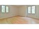Bright and airy bedroom featuring natural light, hardwood floors and neutral walls at 36 Birnamwood Dr, Chapel Hill, NC 27516