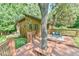 Large wooden deck with outdoor dining area offers gorgeous views and plenty of space to entertain at 36 Birnamwood Dr, Chapel Hill, NC 27516