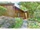 Charming wooden exterior of a house with a manicured front yard and inviting entryway at 36 Birnamwood Dr, Chapel Hill, NC 27516
