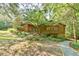 Beautiful exterior of a wood home featuring professional landscaping and stone walkways at 36 Birnamwood Dr, Chapel Hill, NC 27516