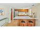Charming kitchen with a quartz countertop bar, modern stainless steel appliances and a tile backsplash at 36 Birnamwood Dr, Chapel Hill, NC 27516
