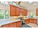Bright kitchen featuring wooden cabinets, stainless steel appliances, and ample counter space at 36 Birnamwood Dr, Chapel Hill, NC 27516