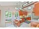Stylish kitchen with wooden cabinets, bar seating, and skylights for ample natural light at 36 Birnamwood Dr, Chapel Hill, NC 27516