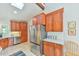 Modern kitchen with wooden cabinets, stainless steel appliances, and a bright, airy atmosphere at 36 Birnamwood Dr, Chapel Hill, NC 27516