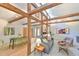 Spacious living room featuring exposed wooden beams, skylights, and modern decor throughout at 36 Birnamwood Dr, Chapel Hill, NC 27516