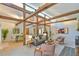 Cozy living room showcasing exposed wooden beams, skylights, comfortable seating, and stylish decor at 36 Birnamwood Dr, Chapel Hill, NC 27516