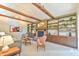 Inviting living room with a brick fireplace, built-in bookshelves, and comfortable seating arrangements at 36 Birnamwood Dr, Chapel Hill, NC 27516