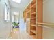 Spacious walk-in closet with built-in shelving and drawers for optimal storage and organization at 36 Birnamwood Dr, Chapel Hill, NC 27516