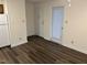 Living area with light walls, and multiple doors at 3601 Helix Ct # 301, Raleigh, NC 27606