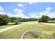Expansive backyard featuring a lush lawn, mature trees, a white picket fence, and a flower bed at 3684 Ben Mil Ct, Franklinton, NC 27525
