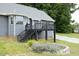 Backyard with a charming deck, patio, and landscaping for outdoor entertaining and relaxation at 3684 Ben Mil Ct, Franklinton, NC 27525