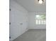 Bedroom with large closets, neutral carpet, and a window with backyard view at 3684 Ben Mil Ct, Franklinton, NC 27525