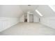 Spacious bonus room featuring plush carpet, skylights, and multiple closets for ample storage at 3684 Ben Mil Ct, Franklinton, NC 27525