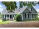 Charming home with gray siding, black shutters, well-maintained landscaping and inviting front entrance at 3684 Ben Mil Ct, Franklinton, NC 27525