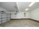 Spacious two-car garage with white walls, concrete flooring, and natural light from two windows at 3684 Ben Mil Ct, Franklinton, NC 27525
