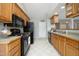 Efficiently designed kitchen with oak cabinetry, modern appliances and easy access to the breakfast bar at 3684 Ben Mil Ct, Franklinton, NC 27525