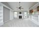 Comfortable living room with fireplace, built-in shelving, and a ceiling fan at 3684 Ben Mil Ct, Franklinton, NC 27525