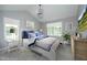 Serene bedroom with plush bedding, ample natural light, a stylish chandelier, and soft neutral tones at 3684 Ben Mil Ct, Franklinton, NC 27525