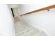 Carpeted staircase with white walls and a wooden handrail leading to the upper or lower level at 3684 Ben Mil Ct, Franklinton, NC 27525