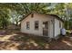 Exterior of a home with a fenced backyard featuring a small outbuilding at 4038 Redwood Rd, Durham, NC 27704