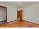 Bedroom with hardwood flooring, closet, and doorway at 4038 Redwood Rd, Durham, NC 27704