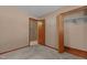 Minimalist bedroom with carpeted floor, and a closet for ample storage at 4038 Redwood Rd, Durham, NC 27704