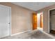 Bedroom with neutral walls, carpet, and doorway at 4038 Redwood Rd, Durham, NC 27704