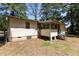 Exterior home view featuring a partially screened porch and a fenced yard at 4038 Redwood Rd, Durham, NC 27704