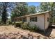 Cozy single-story home featuring a brick and siding exterior with green shutters and a well-maintained front yard at 4038 Redwood Rd, Durham, NC 27704