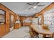 Spacious kitchen with wood paneling, ample cabinet space, and a vintage-style dining area at 4038 Redwood Rd, Durham, NC 27704