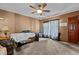 Cozy living room with a ceiling fan, carpeted floor, and natural light, ready for personalization at 4038 Redwood Rd, Durham, NC 27704