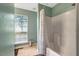 Bright bathroom featuring a shower with white tile and a window at 4524 Sugar Maple Rd, Oxford, NC 27565