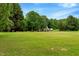 Beautifully landscaped yard with view of the home's exterior at 4524 Sugar Maple Rd, Oxford, NC 27565