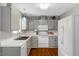 Functional kitchen with white appliances, ample cabinet space, and a sink overlooking the backyard at 4524 Sugar Maple Rd, Oxford, NC 27565