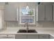 Close-up of the kitchen sink area with modern fixtures and a window providing natural light at 4524 Sugar Maple Rd, Oxford, NC 27565