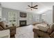 Comfortable living room with a fireplace, ample seating, and a dining area in an open layout at 4524 Sugar Maple Rd, Oxford, NC 27565