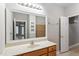 Bathroom vanity with large mirror and good lighting at 4724 Ludwell Branch Ct, Raleigh, NC 27612