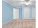Spacious bedroom with light blue walls and ample closet space, perfect for relaxation at 4724 Ludwell Branch Ct, Raleigh, NC 27612