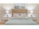 Close-up of a beautifully styled bed with nightstands and lamps at 4724 Ludwell Branch Ct, Raleigh, NC 27612