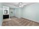 Bedroom featuring blue walls, carpet flooring, and connected bathroom with dark vanity at 4724 Ludwell Branch Ct, Raleigh, NC 27612