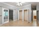 Bedroom featuring tile floors, closet space, and French doors at 4724 Ludwell Branch Ct, Raleigh, NC 27612