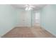 Spacious bedroom with carpet floors, a ceiling fan, and closet doors at 4724 Ludwell Branch Ct, Raleigh, NC 27612