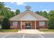 Attractive community center with brick exterior and a welcoming entrance, perfect for gatherings at 4724 Ludwell Branch Ct, Raleigh, NC 27612