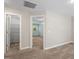 Upstairs hallway with carpet flooring, view of an adjacent bedroom and storage space at 4724 Ludwell Branch Ct, Raleigh, NC 27612