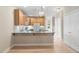 Bright kitchen area with hardwood floors, granite countertops, and easy access to the outdoors at 4724 Ludwell Branch Ct, Raleigh, NC 27612